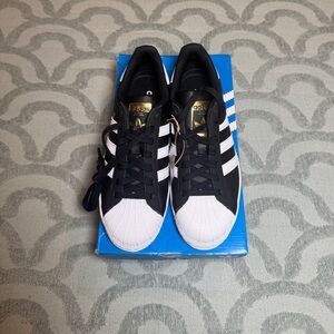 adidas Women's Black and White Sneakers with Gold Accents